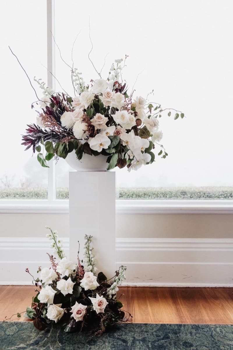Adelaide wedding ceremony arch with trailing floral styling and greenery
