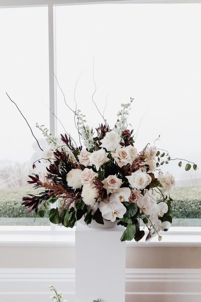 Lush head table floral arrangement at an Adelaide wedding reception