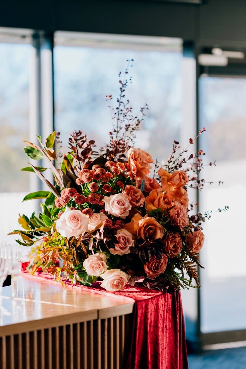 Peach and coral garden rose arrangement for an Adelaide wedding reception