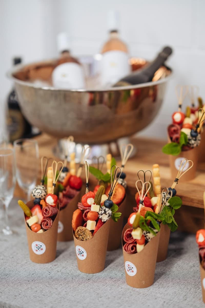 Grazing cups served alongside champagne