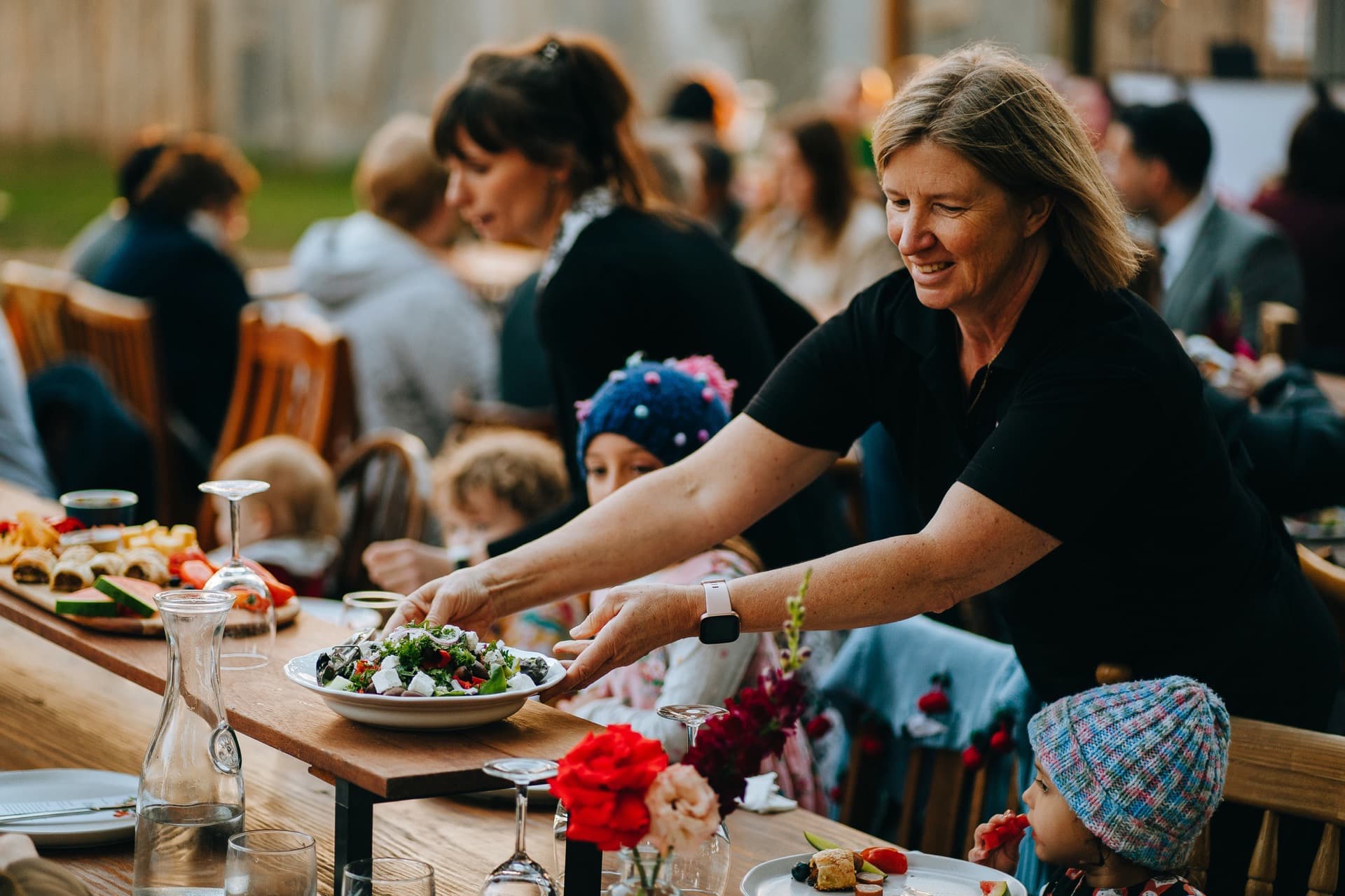 Rose Pappas serving food at an outdoor Adelaide event