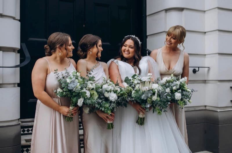 Bridesmaids laughing with handmade posies at an Adelaide wedding