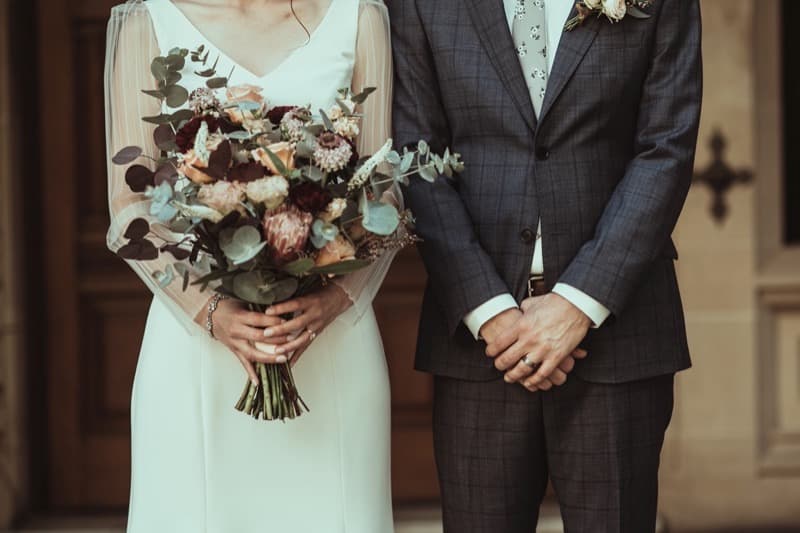 Couple holding native Australian bridal bouquet at an Adelaide wedding